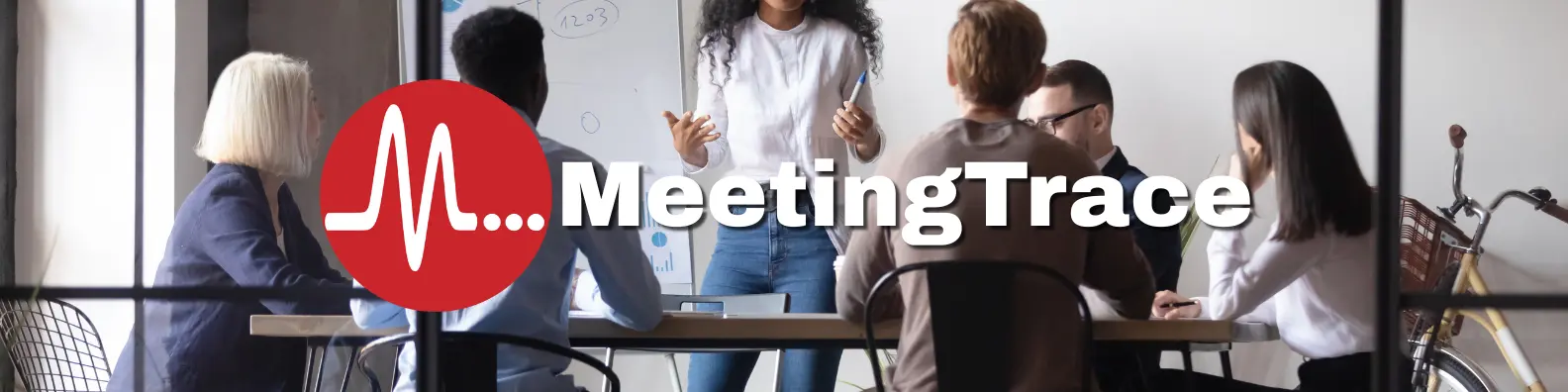 People sitting around a conference table with the MeetingTrace logo overlaid.